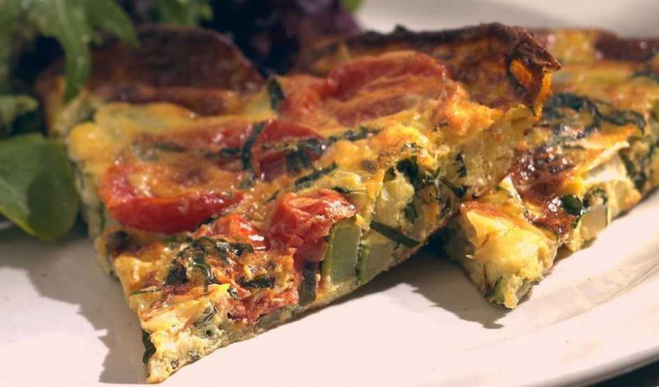 Zucchini frittata A close-up view of zucchini frittata on a plate
