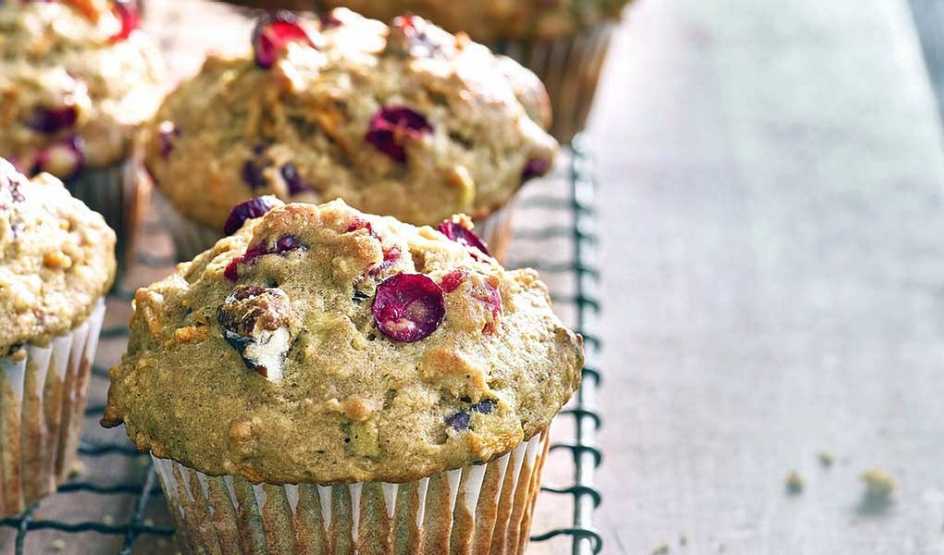 A close-up view of winter squash muffins with cranberries