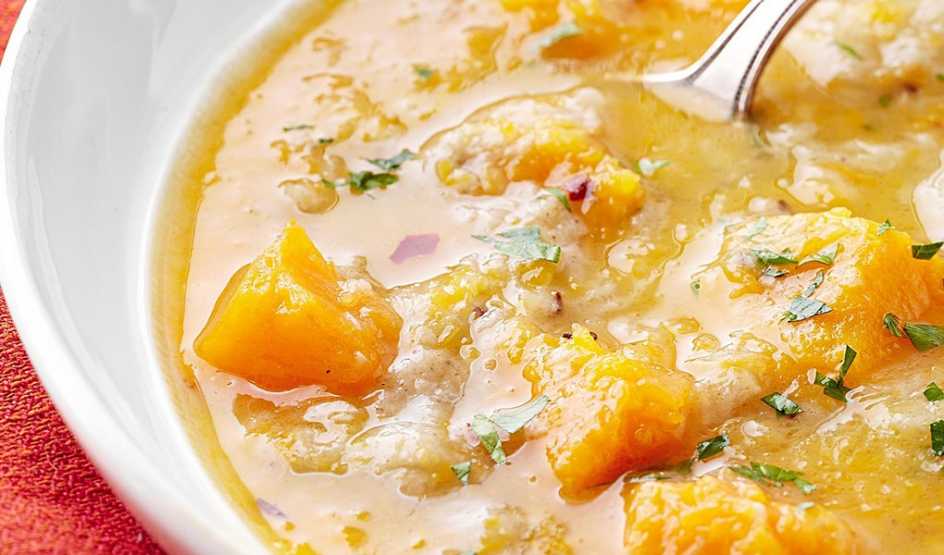 A close-up view of creamy rye and butternut squash soup in a bowl