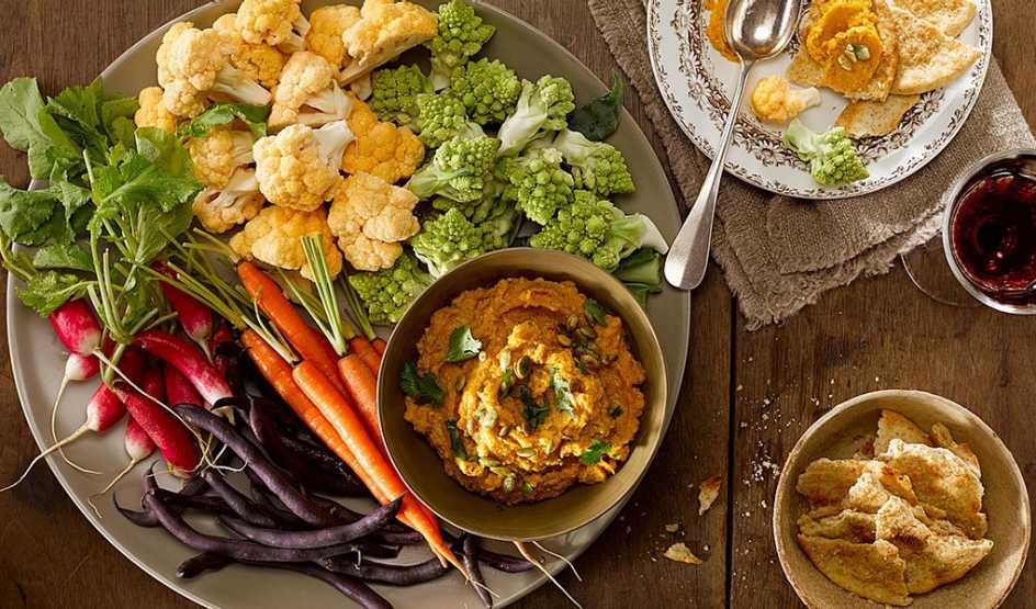 A close-up view of curried butternut squash dip on a plate
