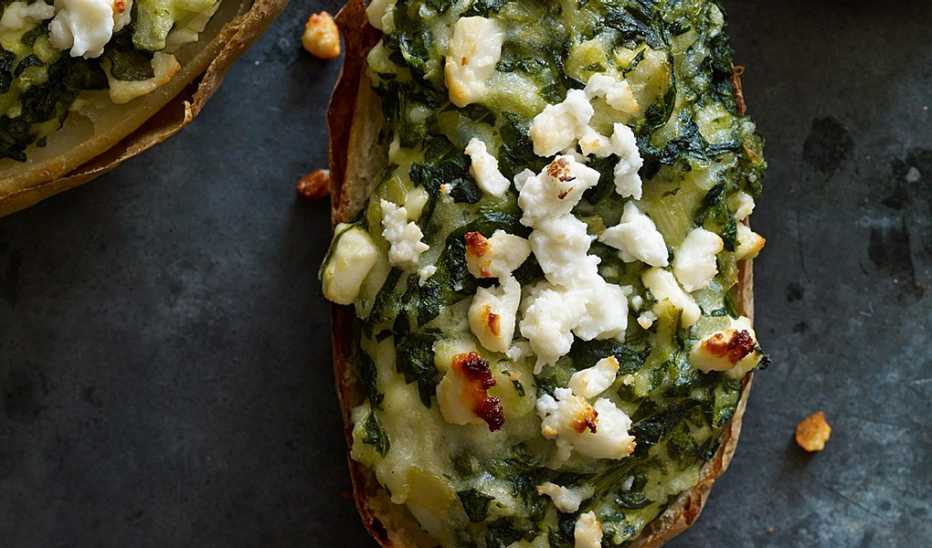A close-up view of spanakopita loaded potatoes