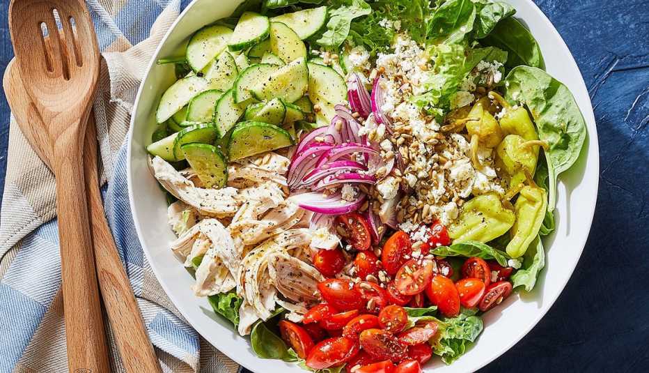 Chopped power salad with chicken A close-up view of a chopped power salad with chicken in a bowl