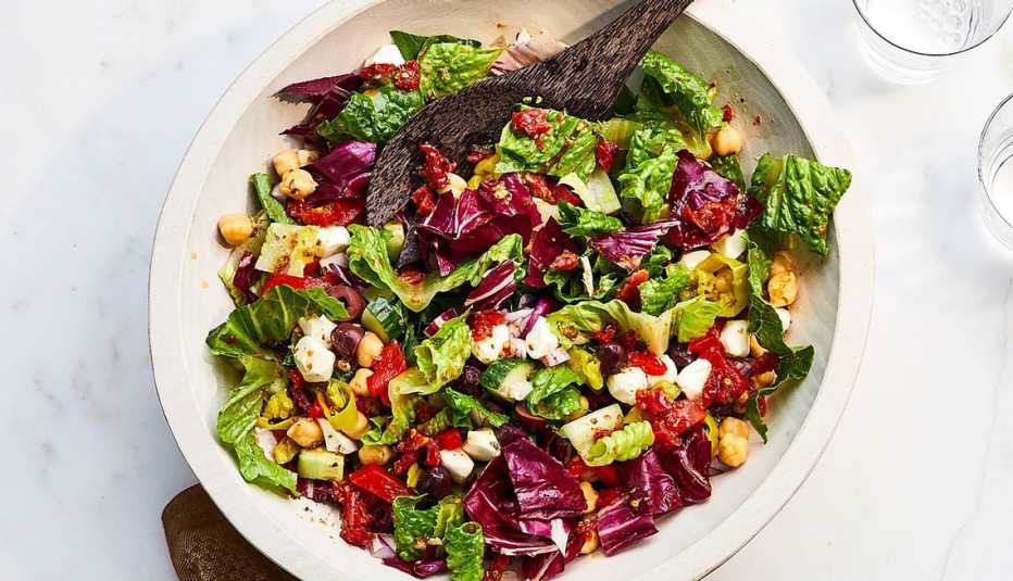 Chopped salad with chickpeas, mozzarella and olives A close-up view of a chopped salad with chickpeas, mozzarella and olives in a bowl