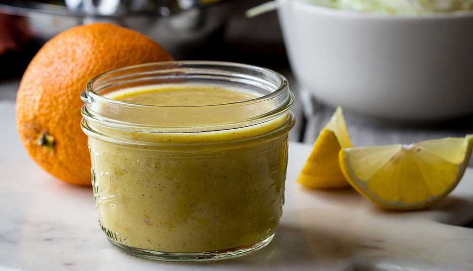 A close-up view of citrus vinaigrette in a glass