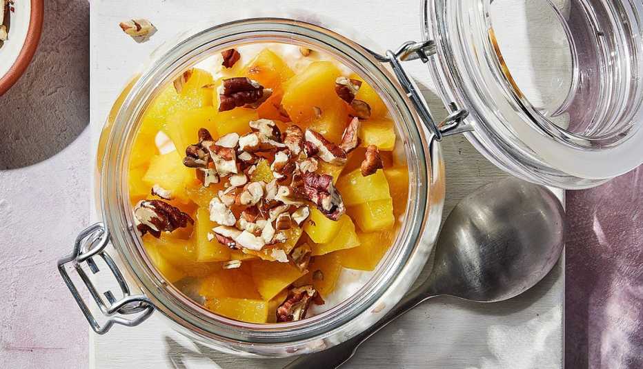A close-up view of a cottage cheese snack jar with fruit