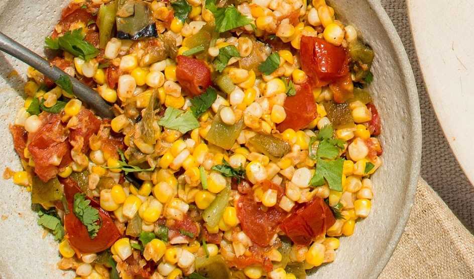 A close-up view of sweet corn salad in a bowl