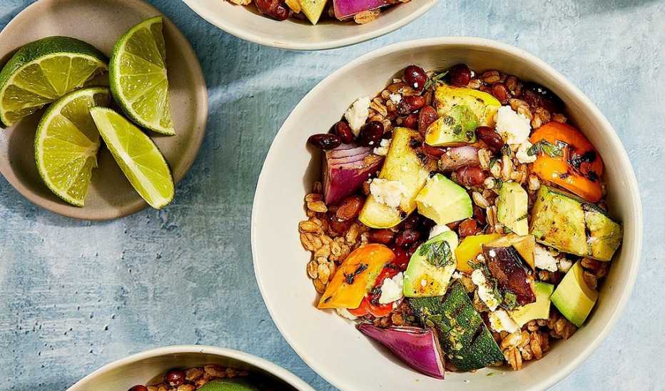 Grilled vegetable and black bean farro bowls recipe A close-up view of grilled vegetable and black bean farro bowls