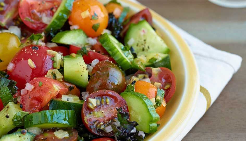 A close-up view of cucumber and tomato salad with preserved lemon