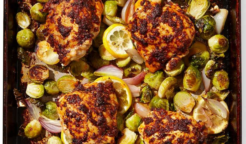 A close-up view of paprika chicken thighs with Brussels sprouts