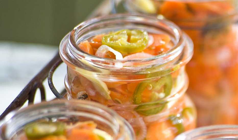 A close-up view of Mexican pickled carrots in a jar