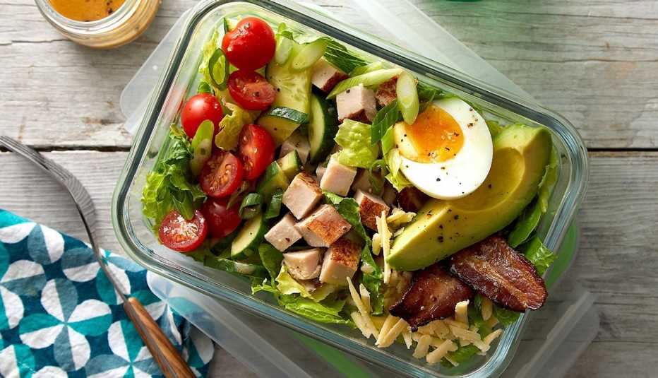 Meal-prep turkey Cobb salad A close-up view of meal-prep turkey Cobb salad in a container