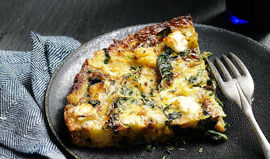 A close-up view of cauliflower and kale frittata on a plate
