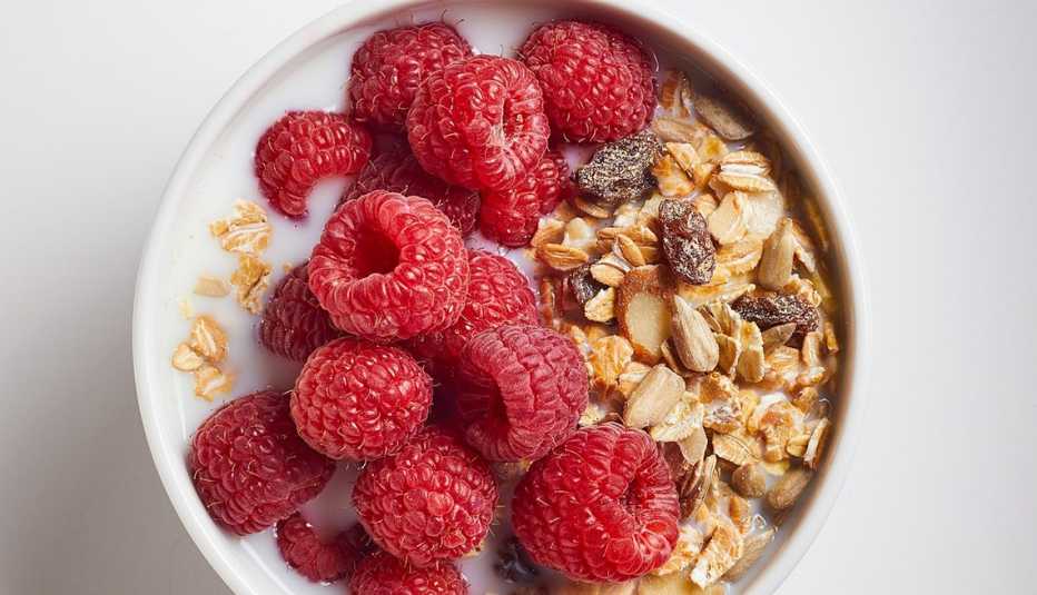 Muesli with raspberries A close-up view of muesli with raspberries in a bowl