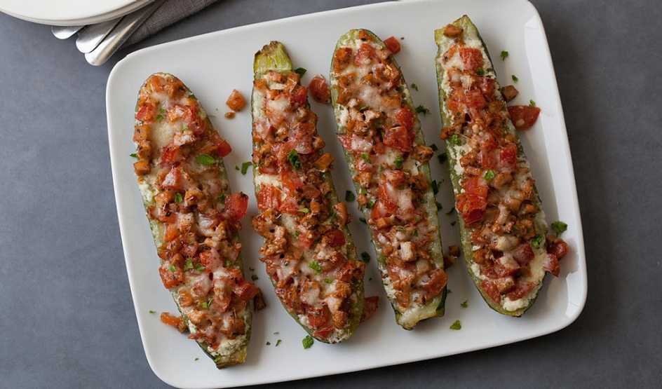 Lasagna-stuffed zucchini A close-up view of lasagna-stuffed zucchini on a plate