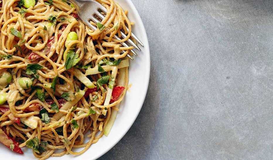 A close-up view of Thai peanut curry noodles on a plate A close-up view of Thai peanut curry noodles on a plate