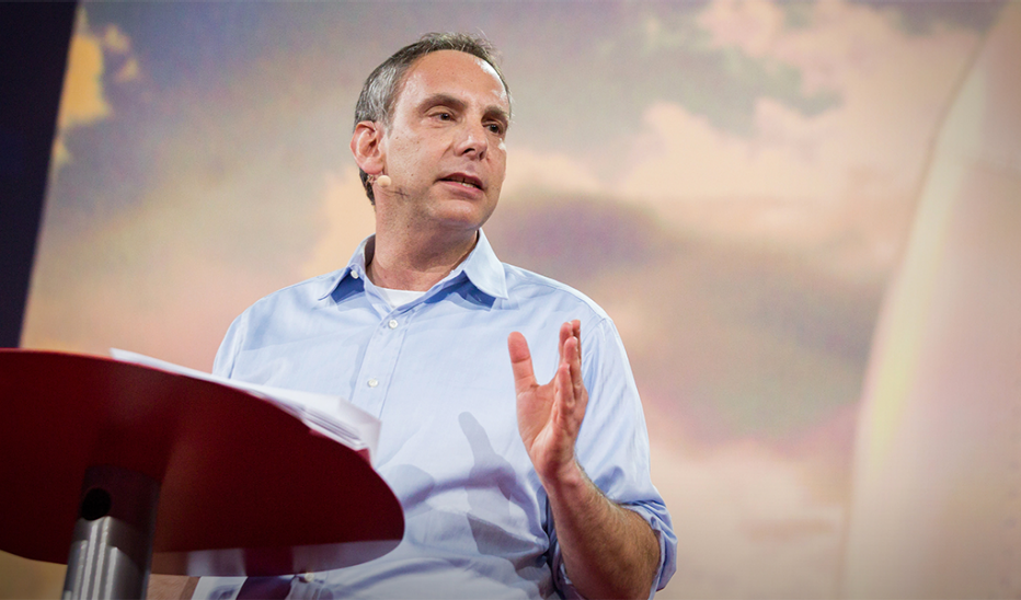 A man, Dave Isay, speaking on stage at TED2015