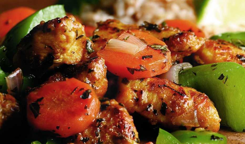 A close-up view of wok-seared chicken and vegetables