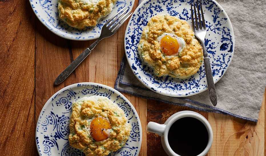 A close-up view of parmesan cloud eggs on plates