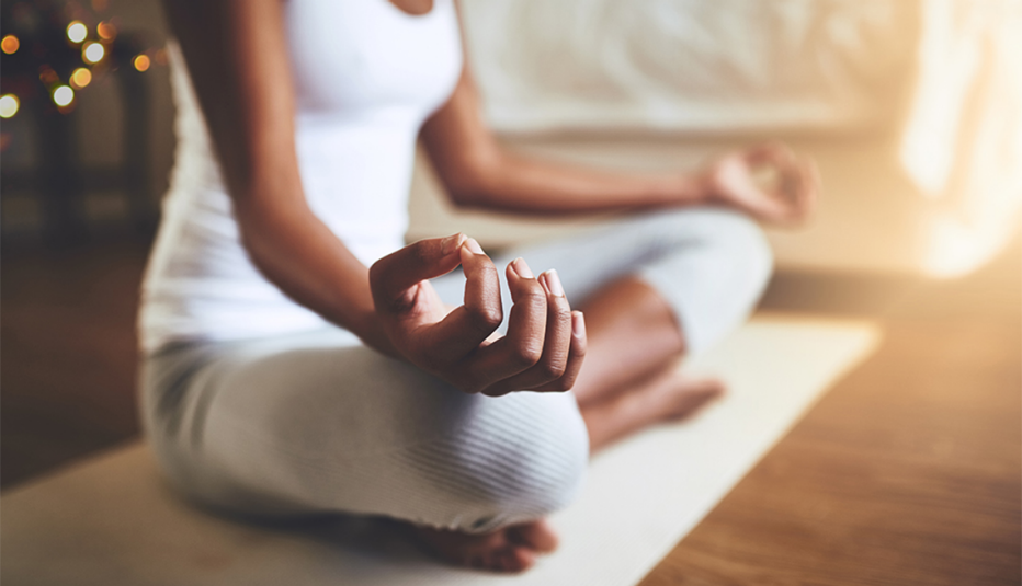 A woman practicing yoga indoors