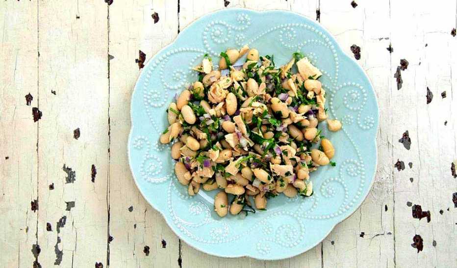 A close-up view of tuna and white bean salad on a plate