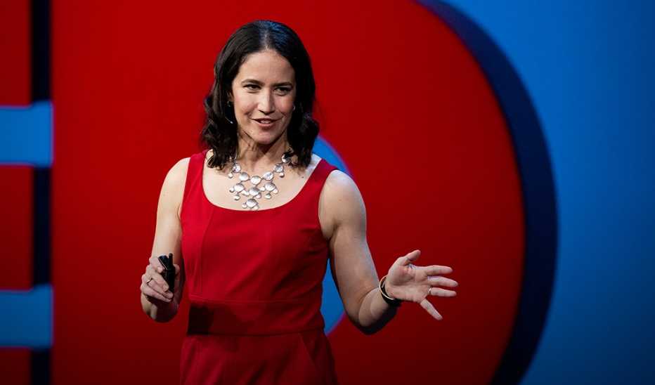 A woman, Catherine Price, speaking on stage at SESSION 7 at TED2022