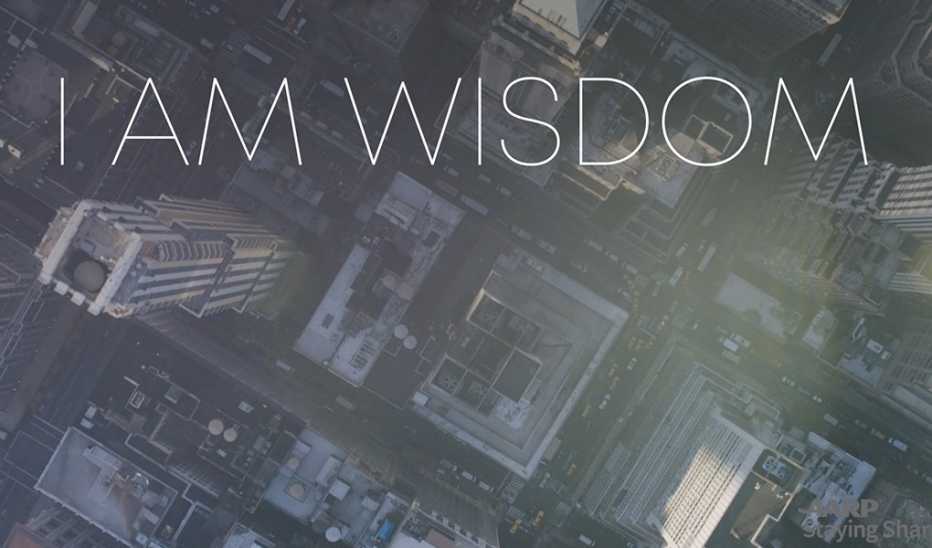 An overhead view of a city with "I Am Wisdom" text